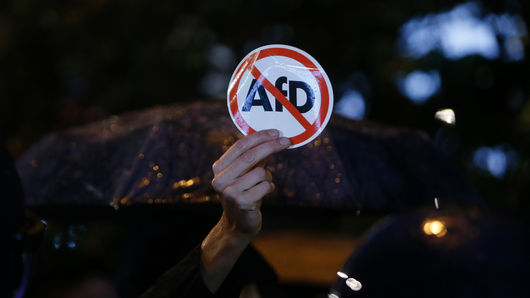 FILE- In this Sept. 24, 2017 file photo police blocks demonstrators protesting against the nationalist 'Alternative for Germany', AfD, party in Berlin, Germany. A Jewish student group says it will protest the far-right Alternative for Germany’s plans to found a Jewish section within party. Jewish Students Union of Germany leader Dalia Grinfeld said Wednesday the party, known as AfD, “isn’t getting a kosher certificate from us” because it is one of the biggest threats to Jewish life in Germany. (AP Photo/Michael Probst)