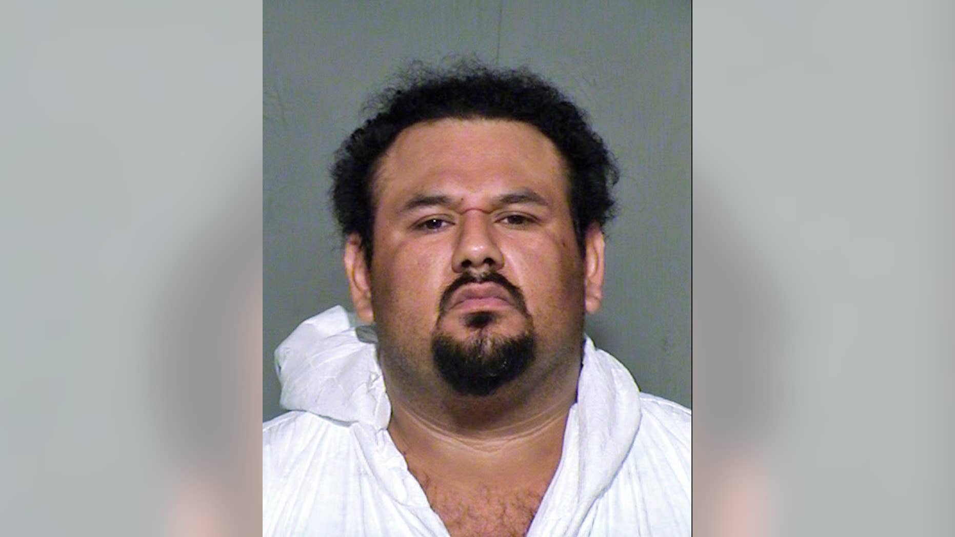 This undated law enforcement booking photo provided by the Maricopa County, Ariz., Sheriff's Office shows Apolinar Altamirano. A surveillance video that captured the killing of a Phoenix-area convenience store clerk shows the suspect, Altamirano, calmly walking behind the counter after pulling the trigger, stepping over the fallen victim and grabbing several packs of Marlboros before slowly exiting. The chilling depiction was outlined in a court document Friday, Jan. 23, 2015, as a Maricopa County Superior Court judge set bail at $1 million. (AP Photo/Maricopa County Sheriff's Office)