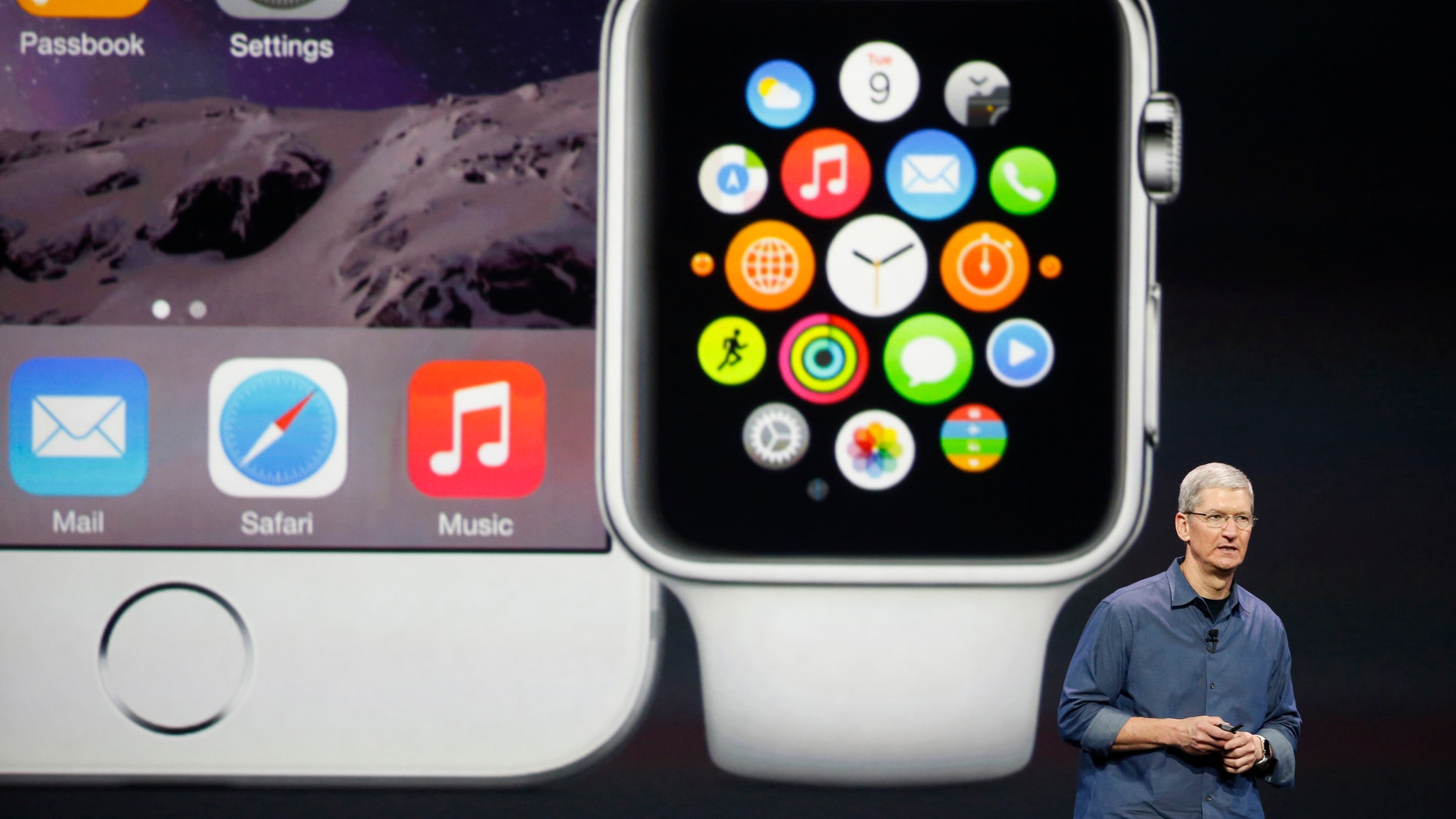 Apple CEO Tim Cook speaks during an Apple event announcing the iPhone 6 and the Apple Watch at the Flint Center in Cupertino, California, September 9, 2014. REUTERS/Stephen Lam (United States - Tags: SCIENCE TECHNOLOGY BUSINESS TPX IMAGES OF THE DAY) - RTR45KY7