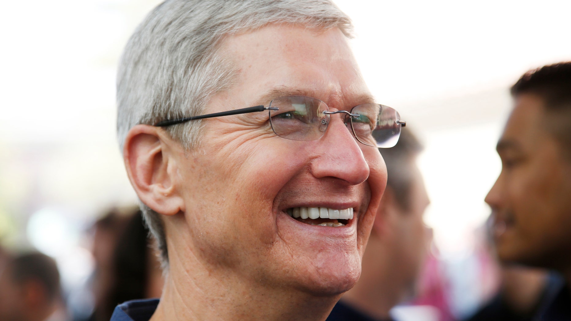 Apple CEO Tim Cook speaks to members of the media during an Apple event announcing the iPhone 6 and the Apple Watch at the Flint Center in Cupertino, California, September 9, 2014. REUTERS/Stephen Lam (United States - Tags: SCIENCE TECHNOLOGY BUSINESS) - RTR45L7U
