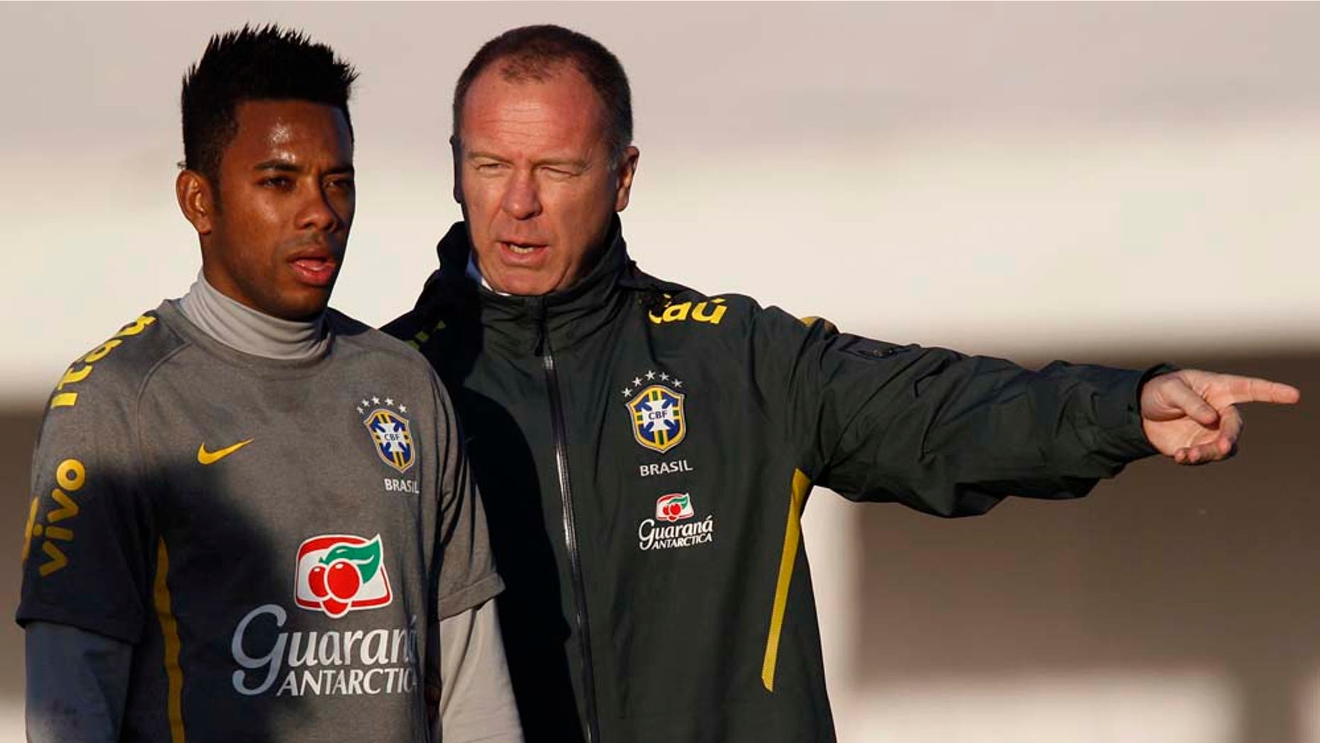 Brazil's soccer coach Mano Menezes, right, talks to player Robinho during a training session ahead of the upcoming 2011 Copa America in Campana, Argentina, Monday, June 27, 2011. Argentina will host the Copa America soccer tournament from July 1 to July 24. (AP Photo/Natacha Pisarenko)