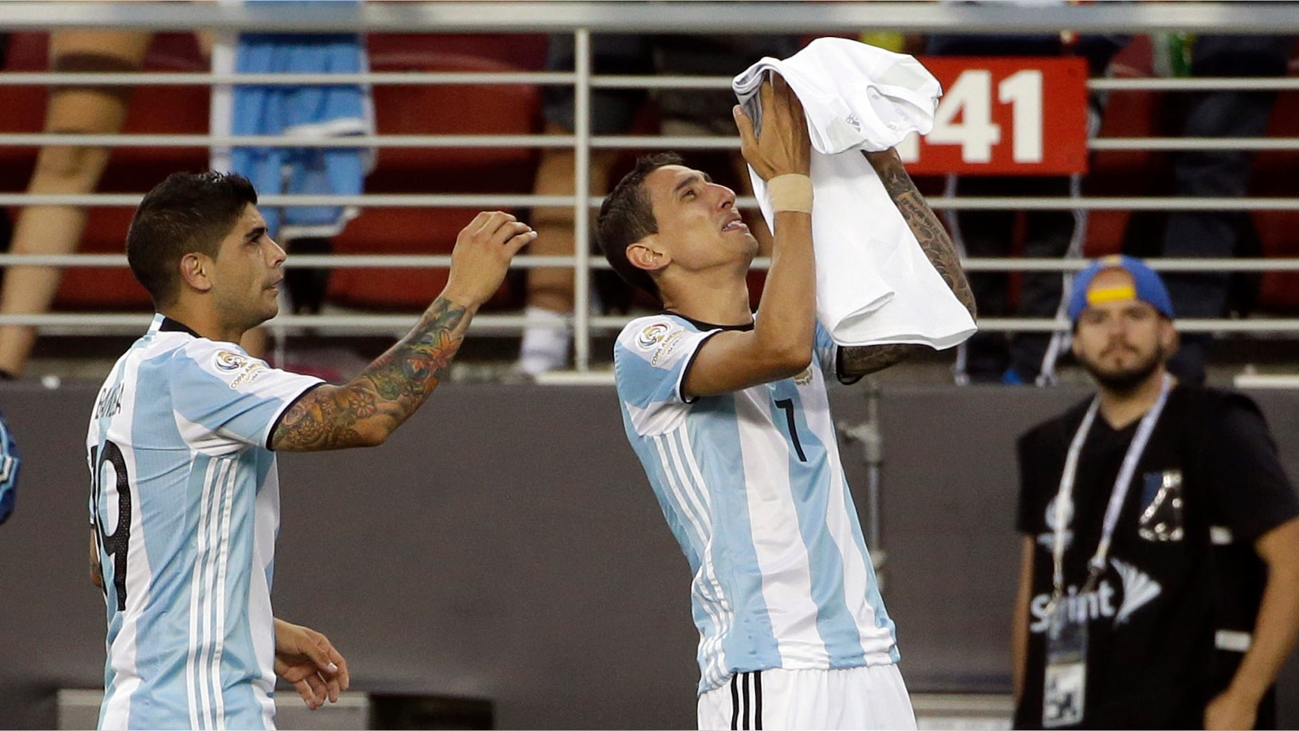 Argentinaâs Angel Di Maria, right, holds a t-shirt that reads "grandmother I will miss you a lot" after he scored against Chile during a Copa America Centenario Group A soccer match at the Levi's Stadium in Santa Clara, Calif., Monday, June 6, 2016. At left is Argentinaâs Ever Banega. (AP Photo/ Marcio Jose Sanchez)