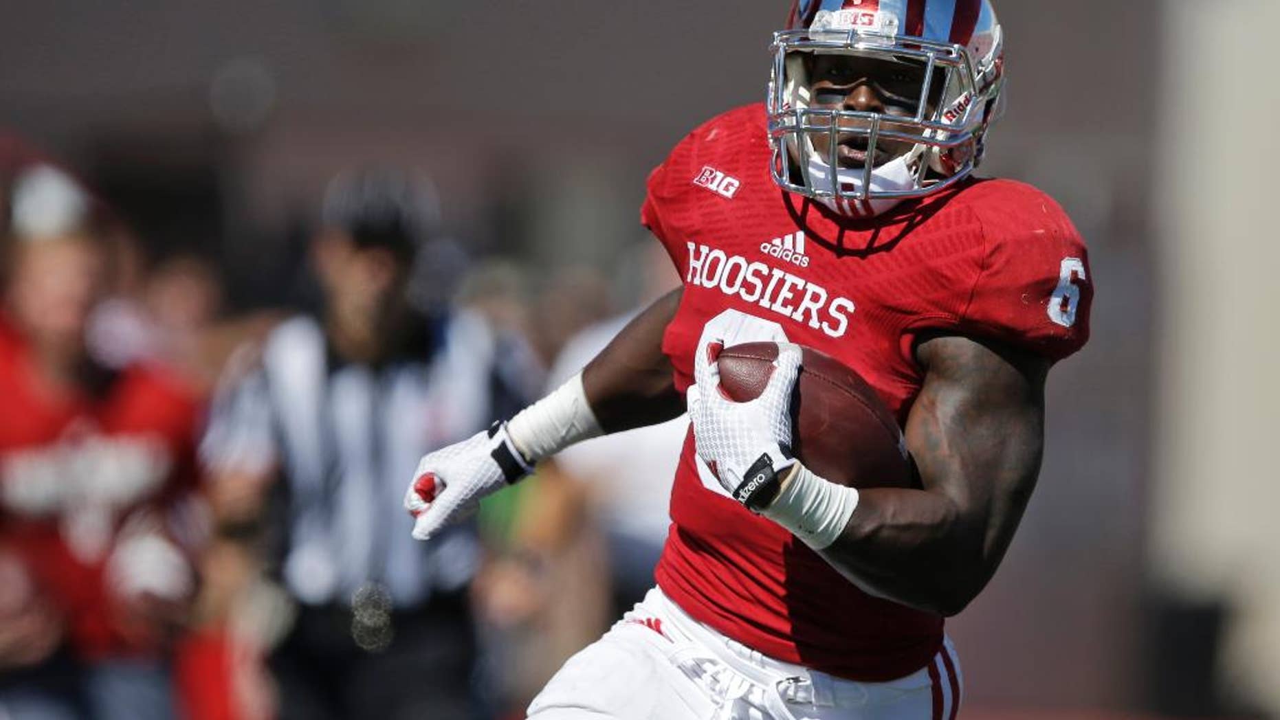 FILE - In this Sept. 27, 2014, file photo, Indiana running back Tevin Coleman (6) runs during the first half of an NCAA college football game against Maryland in Bloomington, Ind. Michigan State coach Mark Dantonio has two ways to get his defense’s attention this week. He can put on Tevin Coleman’s game tapes -- or he can show the players Coleman’s stats. Either way, the eighth-ranked Spartans must figure out how to slow down the nation’s top rusher. (AP Photo/Darron Cummings, File)