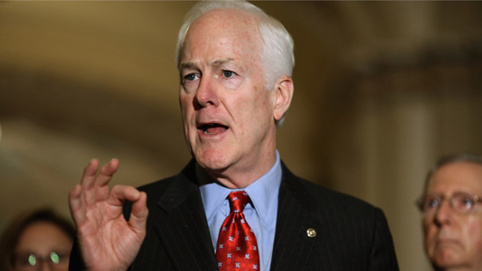 WASHINGTON, DC - OCTOBER 06: Senate Majority Whip John Cornyn (R-TX) (L) talks to reporters after the weekly Republican policy luncheon at the U.S. Capitol October 6, 2015 in Washington, DC. Senate Republicans and Democrats are engaged in budget negotiations in an attempt to avert a possible federal government shutdown on December 11. (Photo by Chip Somodevilla/Getty Images)