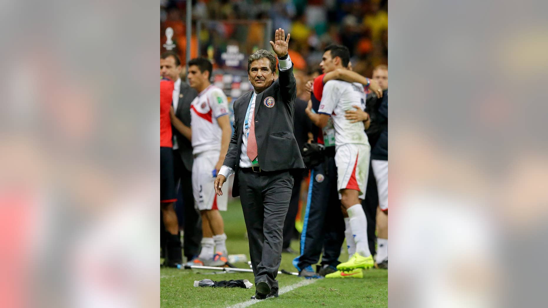 FILE - In this July 5, 2014 file photo, Costa Rica head coach Jorge Luis Pinto waves after a penalty shoot out during the World Cup quarterfinal soccer match between the Netherlands and Costa Rica at the Arena Fonte Nova in Salvador, Brazil. The Colombia-born manager has decided to leave the Costa Rica national team. (AP Photo/Matt Dunham, File)