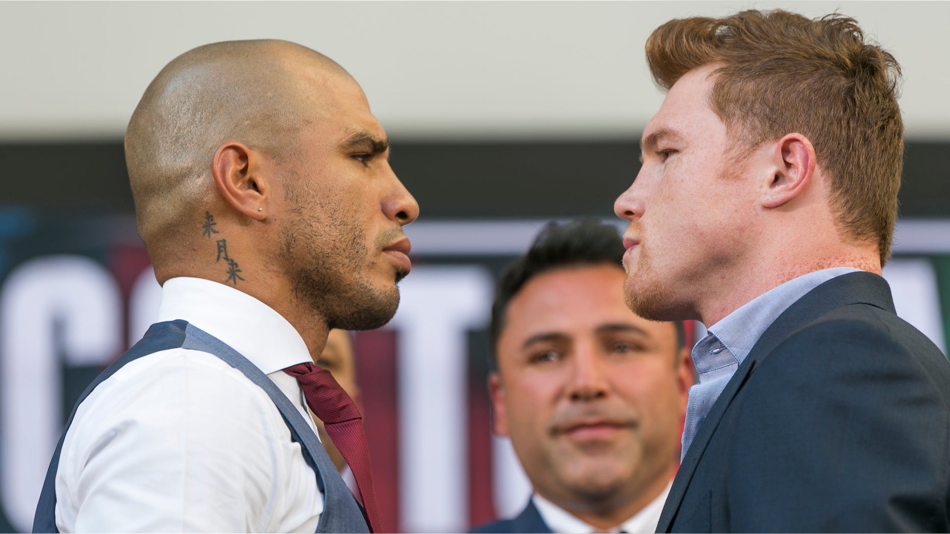 Miguel Cotto and Saul 'Canelo' Alvarez face each other in Los Angeles on Monday, Aug. 24, 2015.