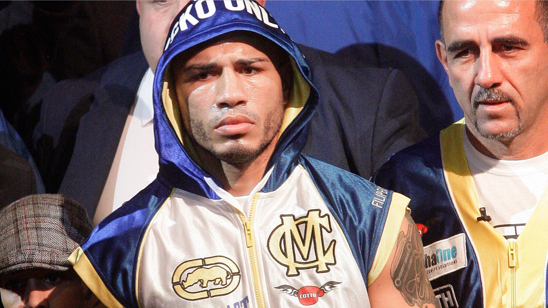 Miguel Cotto, of Puerto Rico, arrives for an WBA World Junior Middleweight Championship boxing match against Antonio Margarito, of Mexico, Saturday, Dec. 3, 2011 in New York. Cotto defeated Margarito with a TKO decision amid confusion in the corner before they came out for the 10th round. (AP Photo/Frank Franklin II)