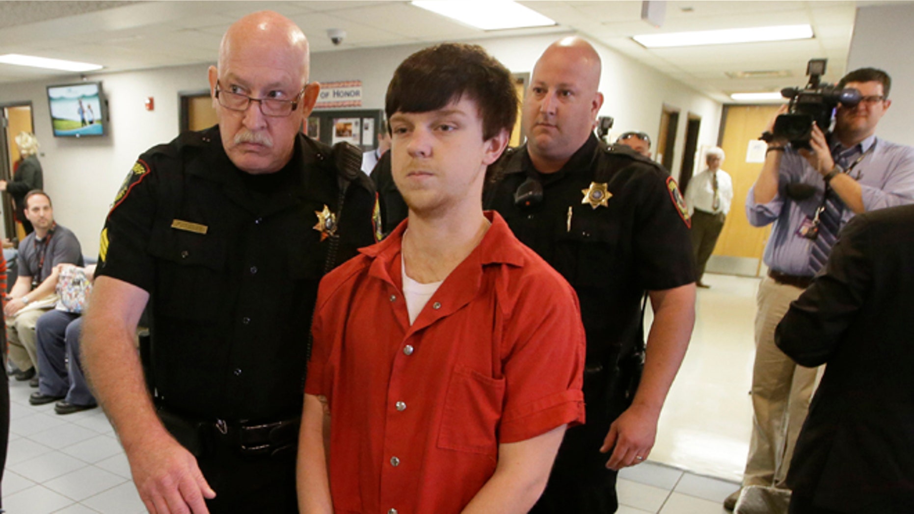 Ethan Couch is led to a juvenile court for a hearing Friday, Feb. 19, 2016, in Fort Worth, Texas. Couch, who used an "affluenza" defense in a fatal drunken-driving wreck is set to appear over whether his case should be transferred to the adult system. (AP Photo/LM Otero)