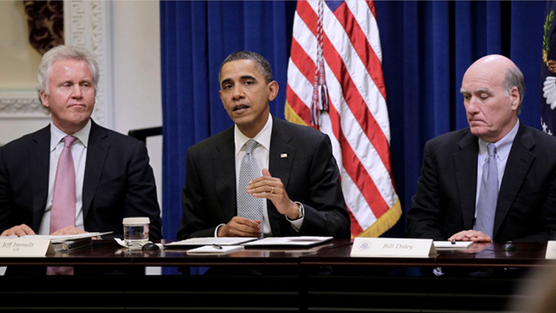 In this file photo, President Obama is shown with GE Chairman Jeffrey Immelt, left, and White House Chief of Staff, Bill Daley, during his meeting with his Council on Jobs and Competitiveness in Washington.