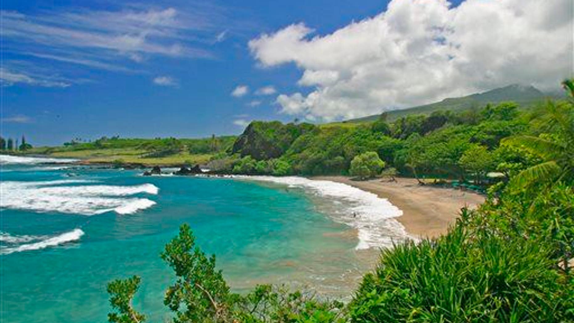 This undated file photo provided by Ron Dahlquist for the Maui Visitors Bureau shows Hamoa Beach in Maui, Hawaii.
