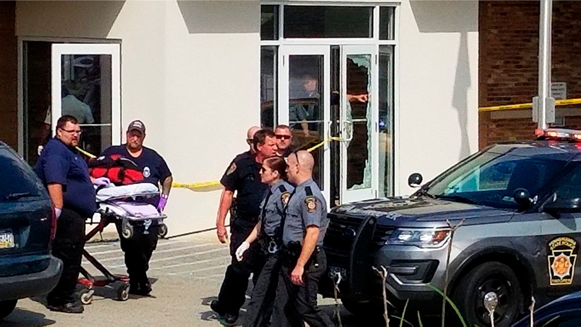 An unidentified gunman was killed by a police officer Wednesday after opening fire at a Pennsylvania magistrate's office and injuring several people, officials said.