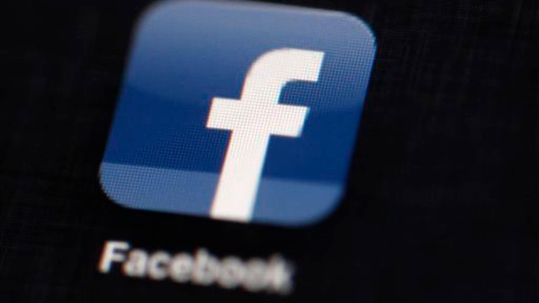 This May 16, 2012 file photo shows the Facebook logo displayed on an iPad.