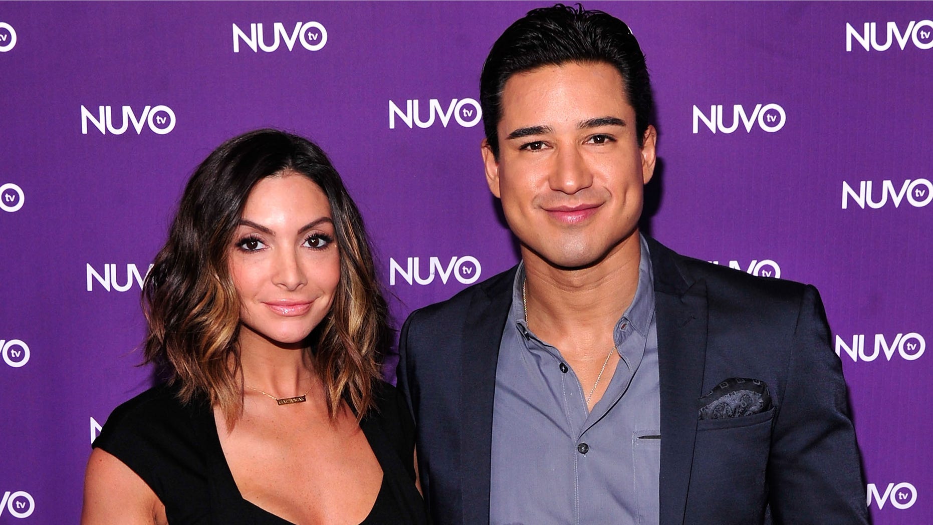 NEW YORK, NY - MAY 12: Courtney Lopez (L) and Mario Lopez attend NUVOtv's 2014-2015 upfront at The Edison Ballroom on May 12, 2014 in New York City. (Photo by Stephen Lovekin/Getty Images for NUVOtv)
