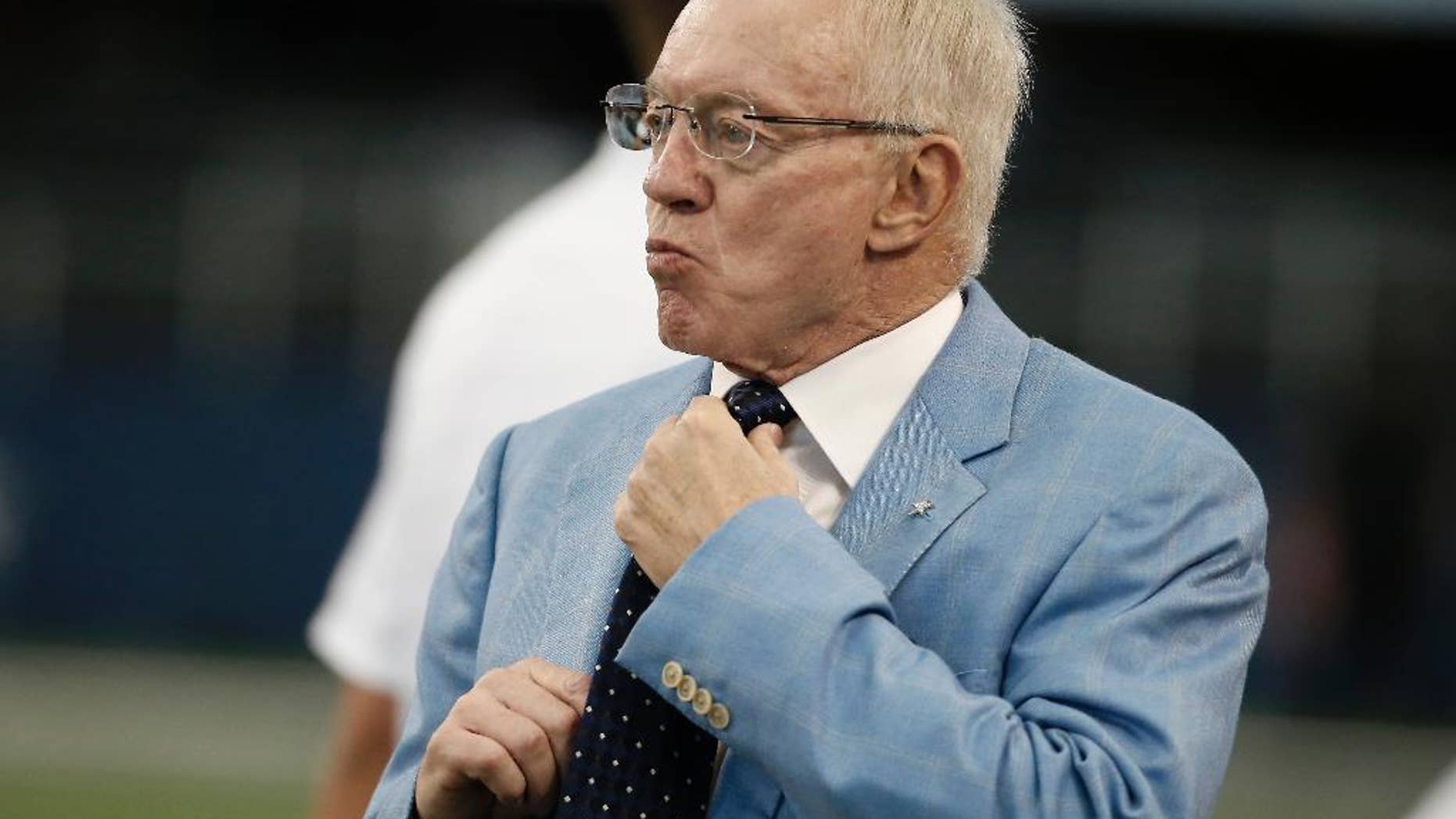 FILE - In this Aug. 28, 2014, file photo, Dallas Cowboys owner Jerry Jones looks on before an NFL preseason football game against the Denver Broncos in Arlington, Texas. The usually optimistic Jerry Jones is using "uphill climb" rather than "Super Bowl" to describe the outlook of his Cowboys. (AP Photo/Brandon Wade, File)