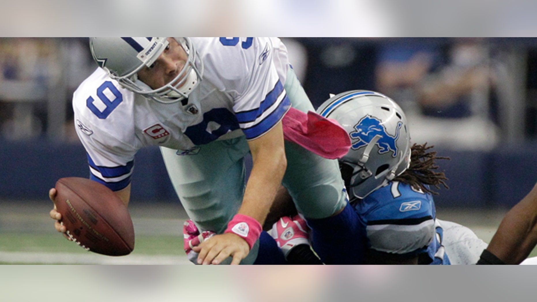 Oct 2: Detroit Lions defensive end Willie Young, right, brings down Dallas Cowboys quarterback Tony Romo (9) in the final minutes of an NFL football game in Arlington, Texas. The Lions won 34-30. (AP Photo/Tony Gutierrez)