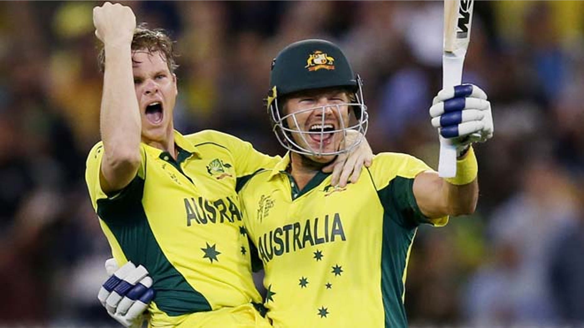 March 29, 2015: Australia's Steve Smith, left, and teammate Shane Watson celebrate after defeating New Zealand by seven wickets to win the Cricket World Cup final in Melbourne, Australia.