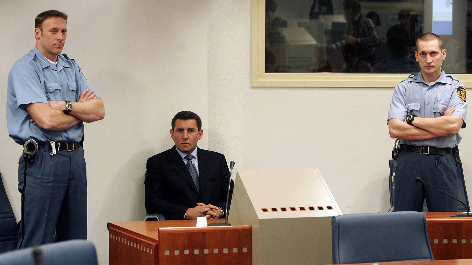 FILE: Former Croatian General Ante Gotovina, center, during his initial appearance at the courtroom of the Yugoslav war crimes tribunal in The Hague, the Netherlands.