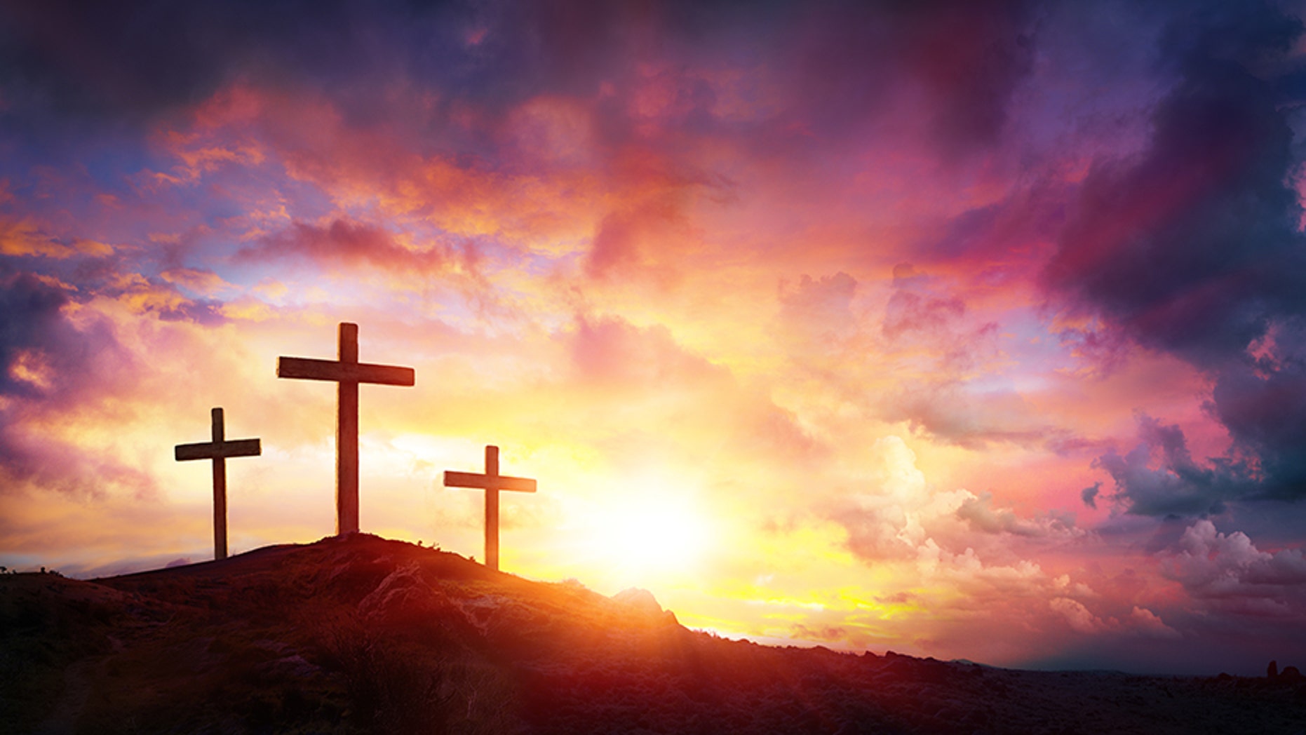 Three Crosses On Mountain With Red Clouds