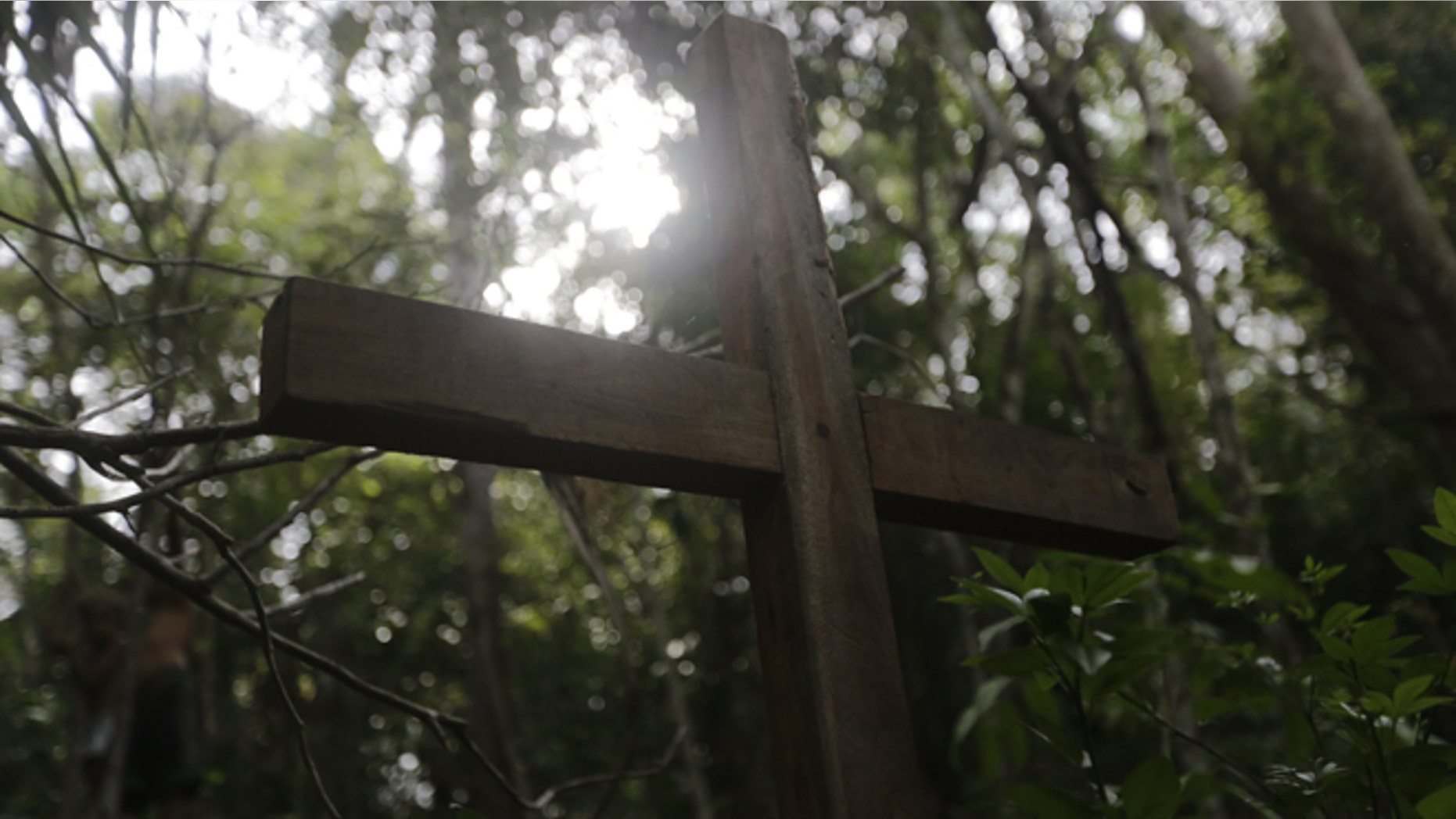 A cross made of wood stands alone in the place where activist Antonio Isidio was found dead last December inside the community of Vergel.