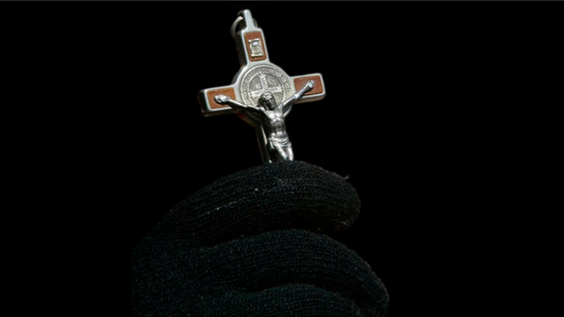Bernadette Reddington prays during the 13th annual Way of the Cross procession over the Brooklyn Bridge Friday, March 21, 2008 in New York. (AP Photo/Mary Altaffer)