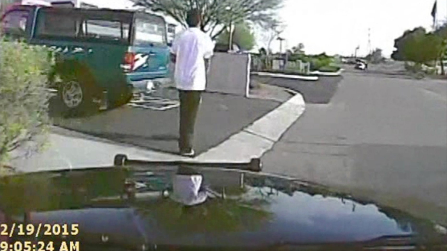 Feb. 19, 2015: In this frame from a dash cam video provided by the Marana (Ariz.) Police Department, a police vehicle nears Mario Valencia. Video released Tuesday, shows a police officer using his cruiser to ram the armed suspect, Valencia, sending him flying in the air before the car smashes into a wall. Valencia survived the crash, and prosecutors cleared the officer of any wrongdoing. (Marana Police Department via AP)