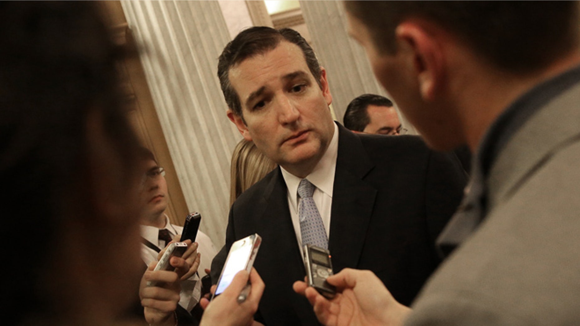 WASHINGTON, DC - DECEMBER 13: U.S. Sen. Ted Cruz (R-TX) speaks with reporters after the U.S. Senate voted to approve a $1.1 trillion omnibus funding bill December 13, 2014 in Washington, DC. Despite CruzÕs efforts to delay the vote due to objections with U.S. President Barack ObamaÕs immigration orders, the Senate approved the funding and will avoid a government shutdown. (Photo by Win McNamee/Getty Images)