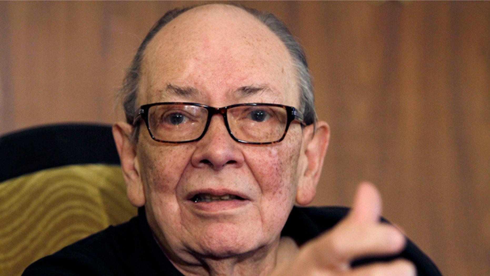 In this photo taken Nov. 13, 2012, Alfredo Guevara, president of the International Festival of New Latin American Cinema, speaks during a press conference in Havana, Cuba. The filmmaker, who was recognized as one of Cuba's main cultural leaders, died Friday morning, April 19, 2013. He was 87. (AP Photo/Franklin Reyes)