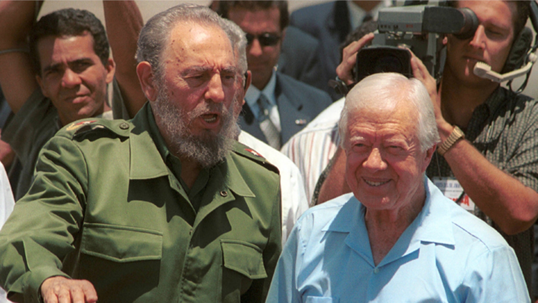 405512 01: Cuban leader Fidel Castro (L) speaks with the former U.S. President Jimmy Carter during a departure ceremony at Jose Marti International airport May 17, 2002 in Havana, Cuba. Carter visited for six days in an effort to improve relations between the U.S. and Cuba. (Photo by Jorge Rey/Getty Images)