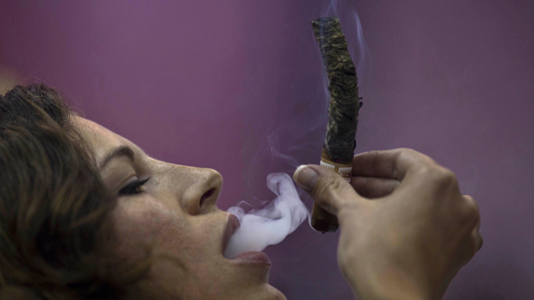 April Angeloni from California during the competition for the longest ash in Havana, on Feb. 27, 2014.