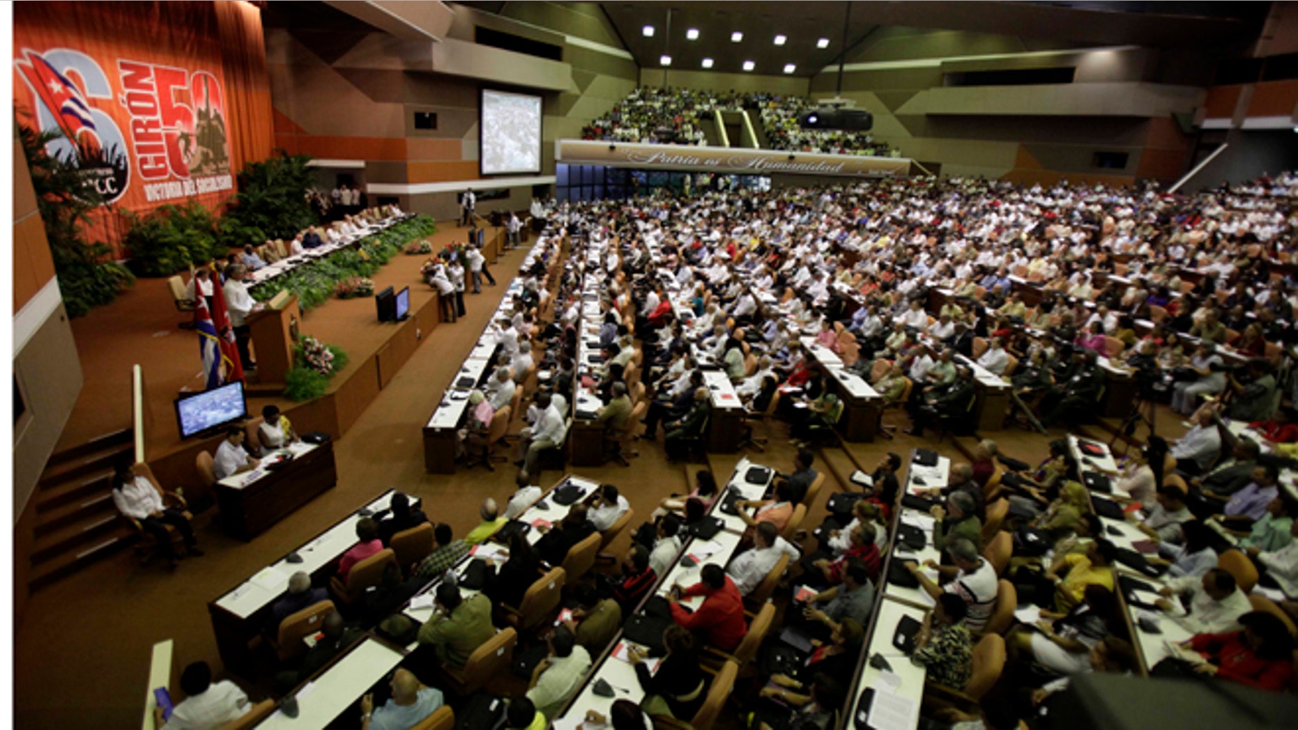 FILE - In this April 19, 19, 2011 file photo, members of the Cuban Communist Party attend the 6th Congress in Havana, Cuba, when President Raul Castro was named first secretary of Cuba's Communist Party, with his aging brother Fidel not included in the leadership for the first time since the party's creation 46 years ago. Days after President Barack Obamas historic visit to Cuba in March 2016, party leaders are under highly unusual public criticism from their own ranks for imposing new levels of secrecy about the future of social and economic reforms. (AP Photo/Javier Galeano, File)