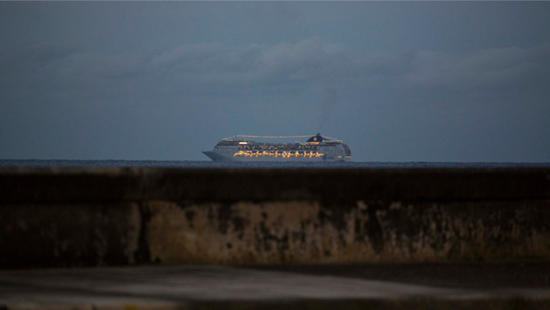 This Jan. 21, 2016 photo shows the MSC Opera cruiser off the coast of Havana as it departs Cuba. Cuban state media announced on Friday, April 22, 2016 the loosening of the government's policy that banned Cuban-born people from arriving by sea. Those prohibitions were put in place in response to Cuban exiles launching attacks from the water in the first years after the Cuban revolution. (AP Photo/Desmond Boylan)