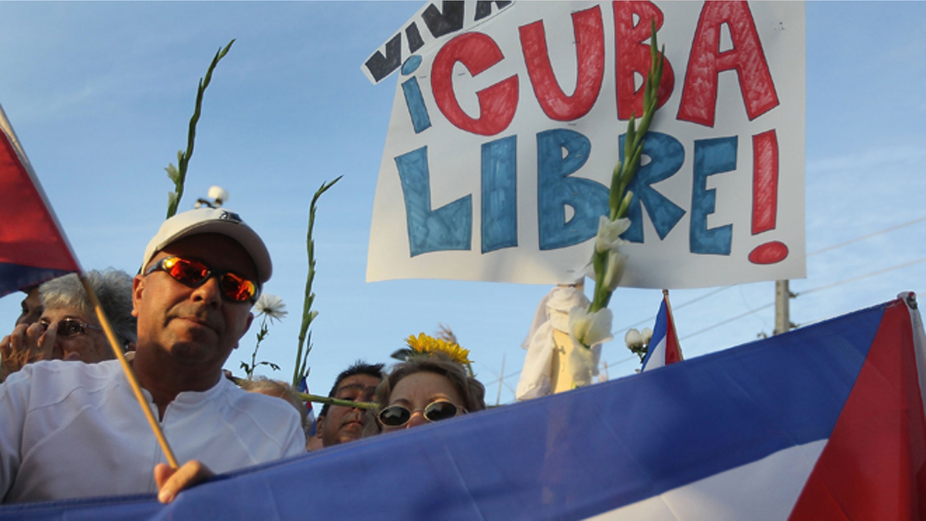 MIAMI - MARCH 25: People show their support for Cuba's Las Damas de Blanco on March 25, 2010 in Miami, Florida. In Cuba last week the Las Damas de Blanco, Ladies in White, who are peaceful dissidents, were attacked by government security forces in Havana. (Photo by Joe Raedle/Getty Images)