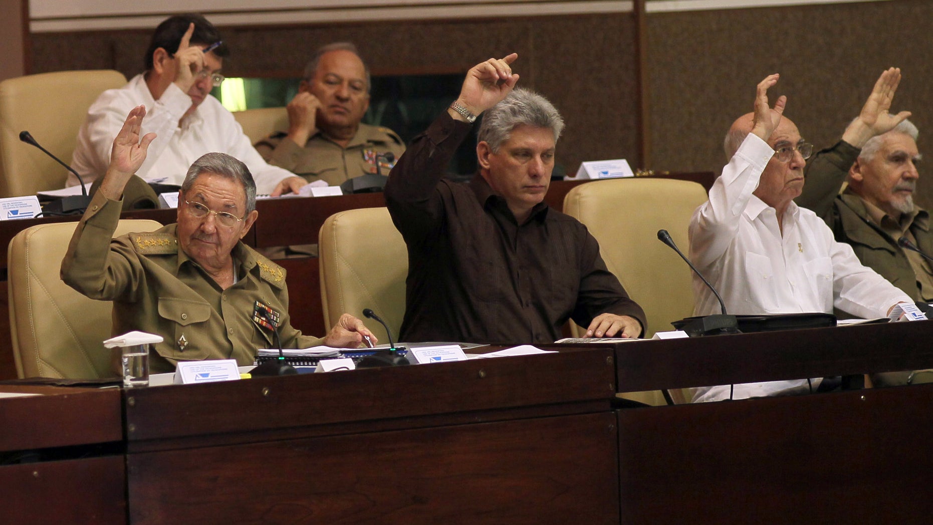 Cuba's President Raul Castro, Cuba's Vice-President Miguel Diaz-Canel and First Vice-President of the Council of State Jose Ramon Machado Ventura during an extraordinary session at the National Assembly in Havana, Cuba, Saturday, March. 29, 2014.