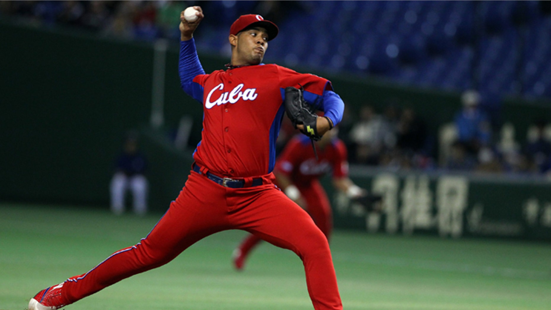 TOKYO, JAPAN - MARCH 11: Starting Pitcher Vladimir Garcia #34 of Cuba pitches during the World Baseball Classic Second Round Pool 1 game between Cuba and the Netherlands at Tokyo Dome on March 11, 2013 in Tokyo, Japan. (Photo by Koji Watanabe/Getty Images)