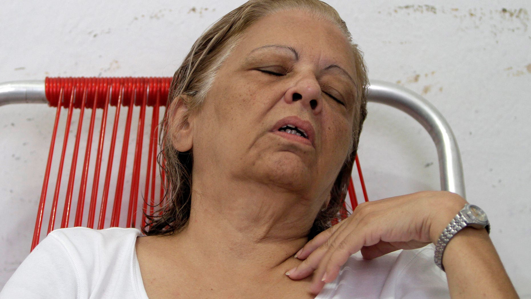 Cuba dissident Martha Beatriz Roque rests after giving an interview in Havana, Cuba, Tuesday, Sept. 11, 2012. The prominent dissident has declared a hunger strike and says 12 other opposition members are joining her.
