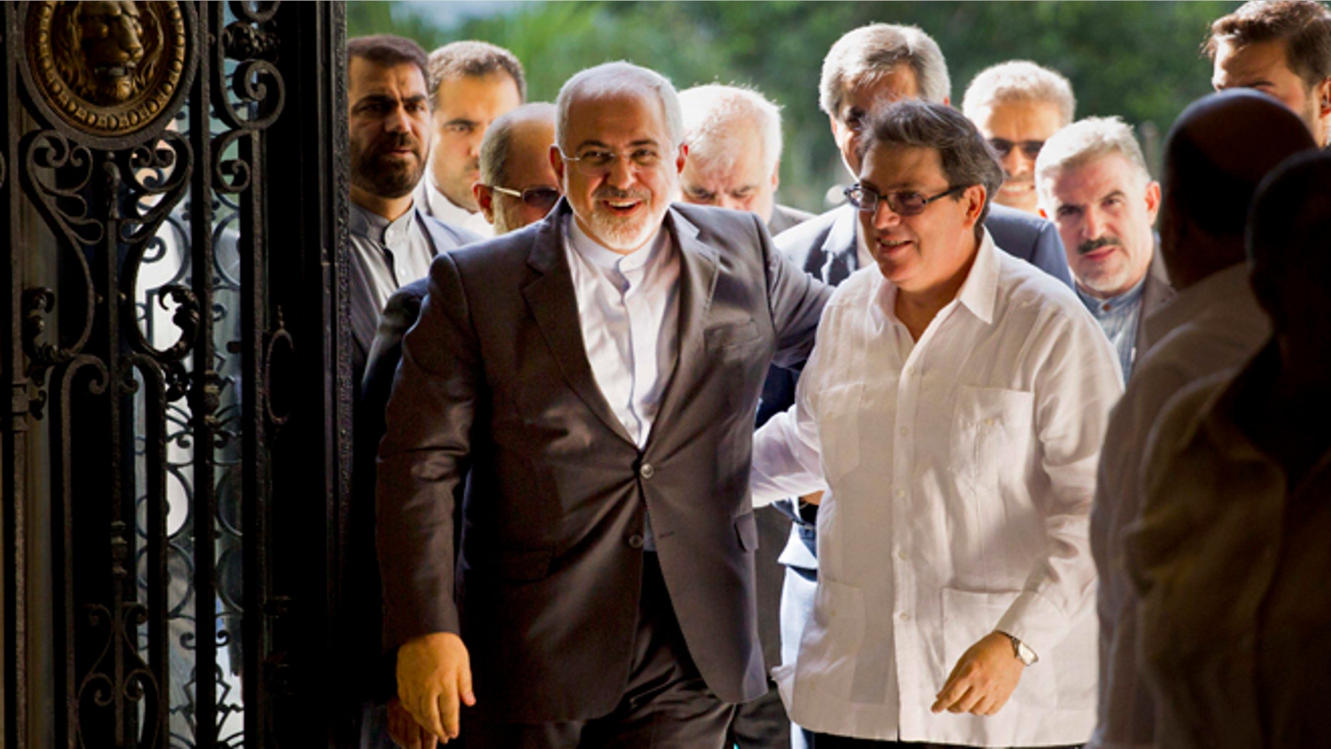 Iranian Foreign Minister Mohammad Javad Zarif, left, is welcomed by Cuban Foreign Minister Bruno Rodriguez, in Havana, Cuba, Monday, Aug. 22, 2016. Irans foreign minister begun a Latin American tour in Cuba, declaring Iran and Cuba united by their histories of resisting what he called U.S. atrocities. Zarif also plans to visit Nicaragua, Ecuador, Chile, Bolivia and Venezuela. (AP Photo/Ramon Espinosa)