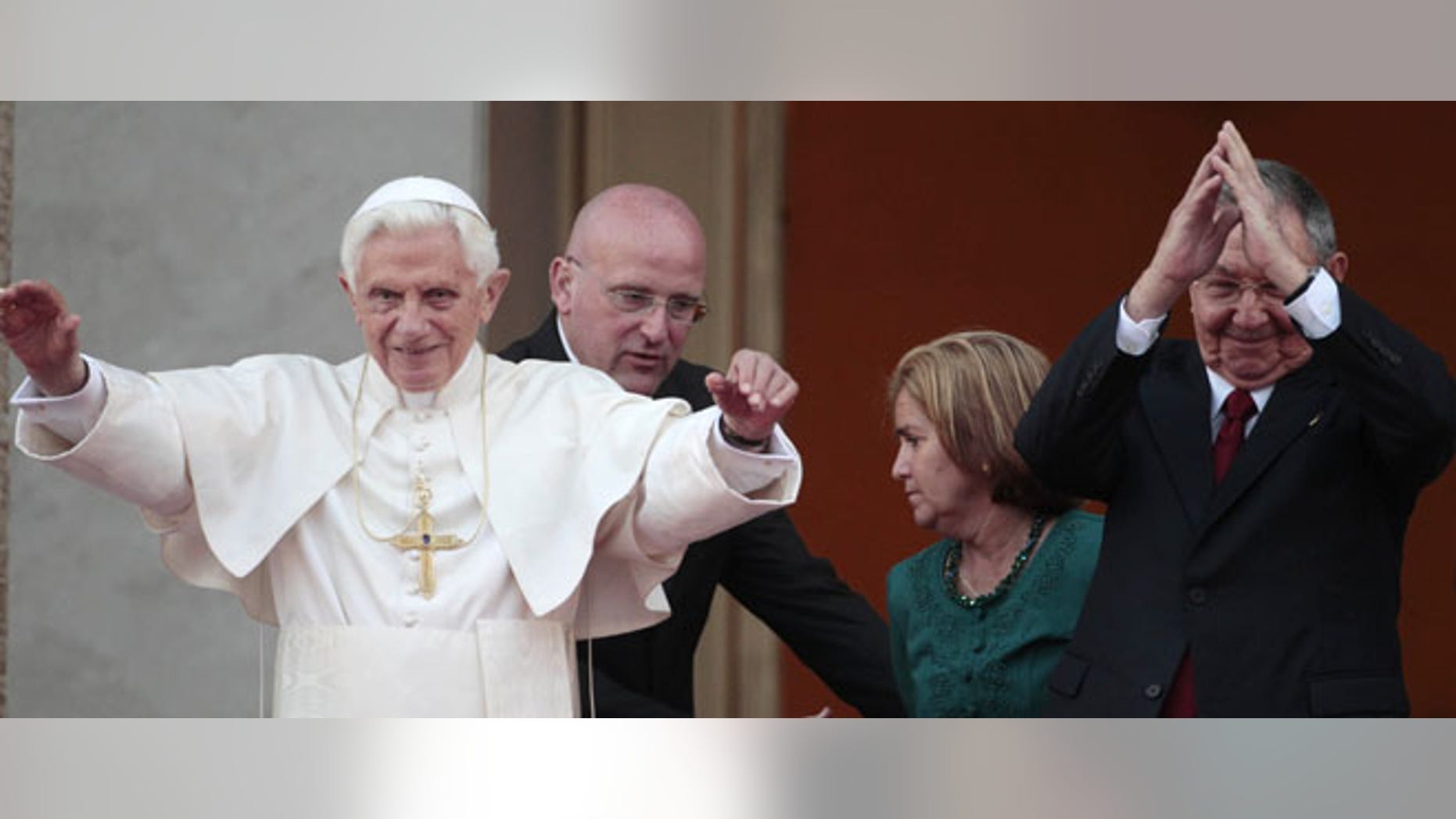 Pope Benedict XVI, left, and Cuba's President Raul Castro wave to journalists after a meeting in Havana, Tuesday, March 27, 2012. (AP Photo/Gregorio Borgia)