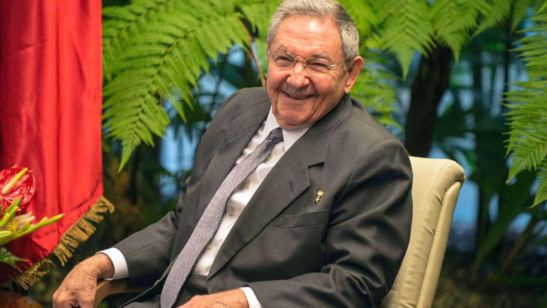 FILE - In this March 27, 2014 file photo, Cuba's President Raul Castro smiles during a meeting with Vietnam's Prime Minister Nguyen Tan Dung at Revolution Palace in Havana, Cuba. Castro is marking his 83rd birthday privately on Tuesday, June 3, 2014, a milestone that is passing without fanfare. Castro has said he intends to remain in office no longer than his current term, which ends in 2018. (AP Photo/Adalberto Roque, Pool, File)