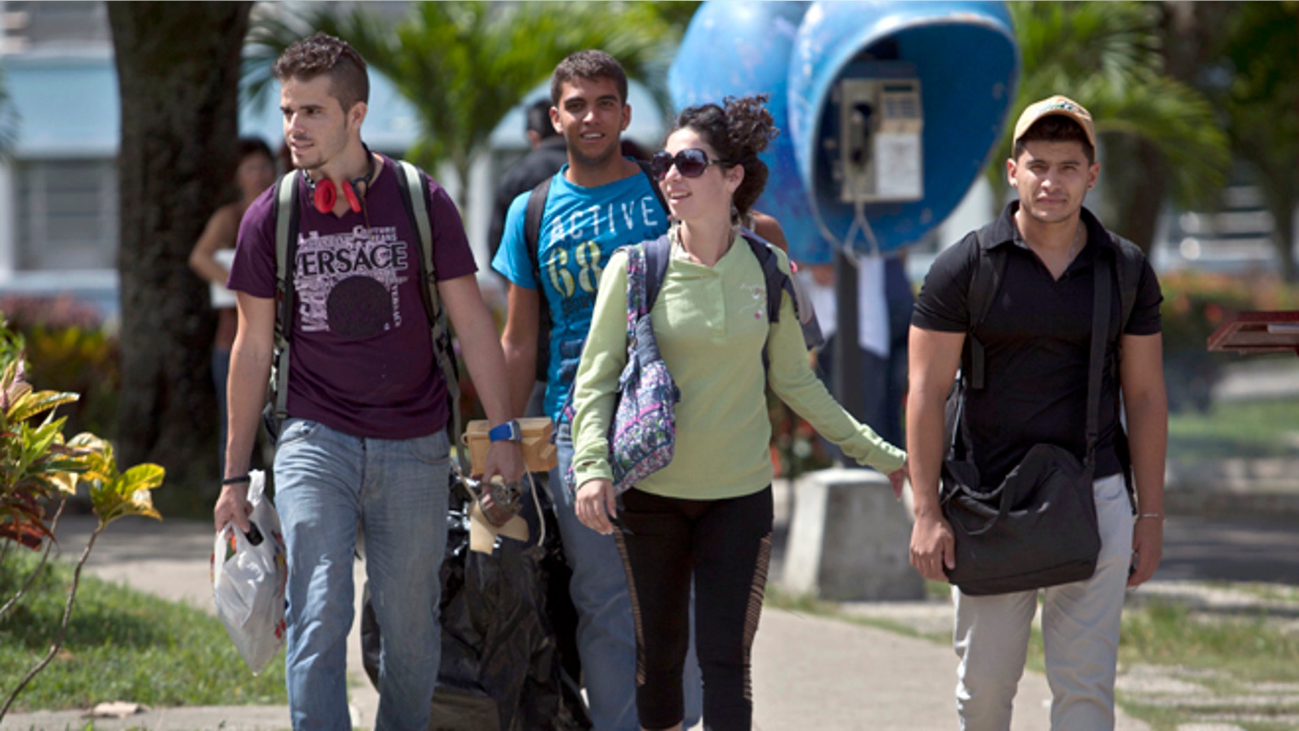 In this July 11, 2014 file photo, Cuban students exit Marta Abreu Central University in Santa Clara, Cuba. Since the U.S. eased travel restrictions in 2015, several colleges have struck agreements with Cuban schools to create exchange programs for students and faculty. More American colleges are planning study trips to Cuba. Both sides are exploring research collaborations. (AP Photo/Franklin Reyes, File)