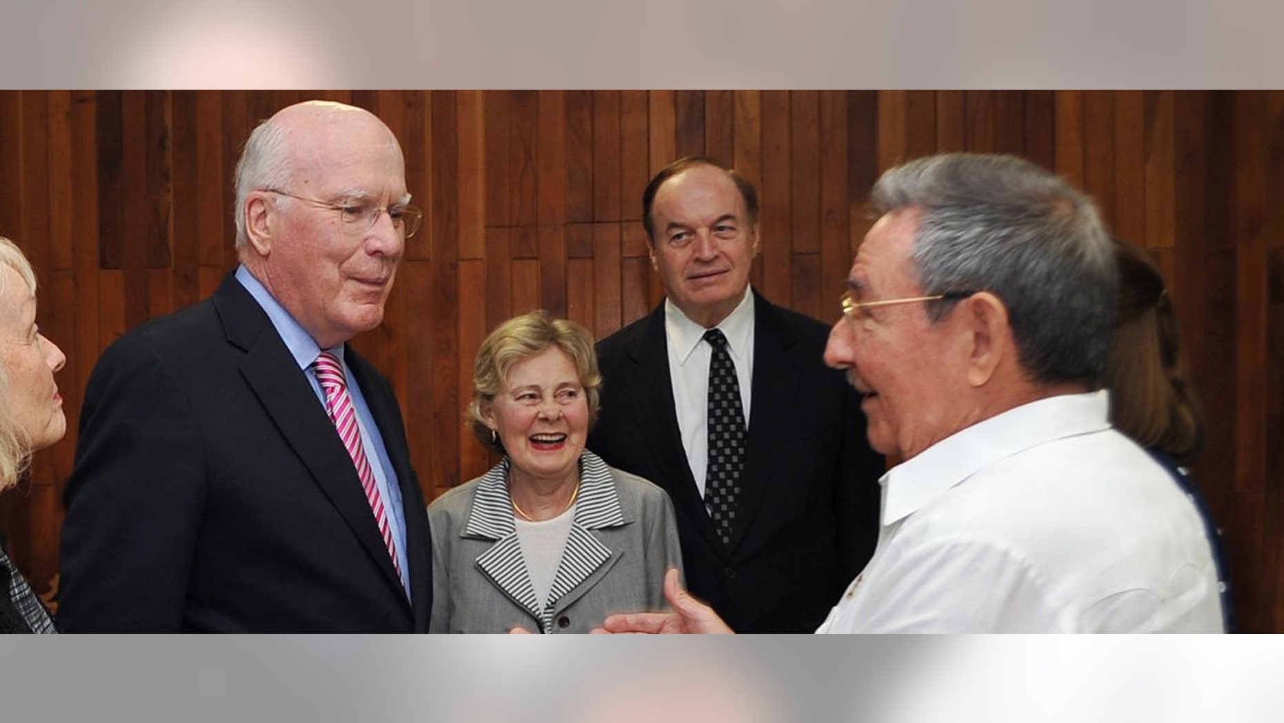 In this photo released by Cuba's state-run Granma newspaper, Cuba's President Raul Castro, right, speaks with U.S. Sen. Patrick Leahy, left, a Democrat from Vermont, as U.S. Senator Richard Shelby, a Republican from Alabama, behind right, watches in Havana, Cuba, Thursday Feb. 23, 2012. Senator Leahy says he met with imprisoned American Alan Gross and discussed the man's case with Raul Castro, but that no release was likely any time soon. The woman at center is unidentified. (AP Photo/Geovani Fernandez, Granma)