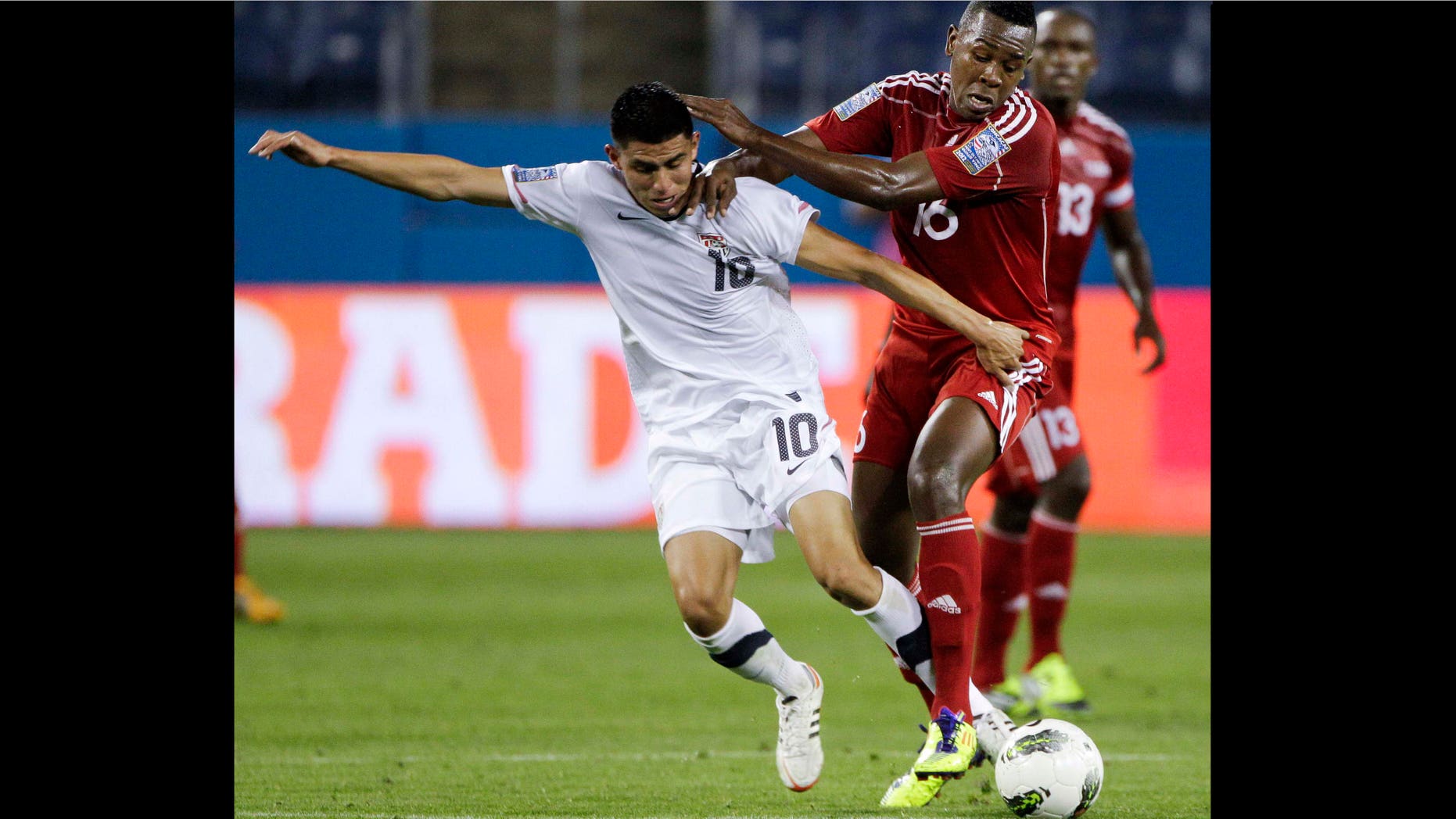 United States midfielder Joe Corona (10) vies for the ball with Cuba's Heviel Cordoves (16) in the first half of a CONCACAF Olympic qualifying soccer match on Thursday, March 22, 2012, in Nashville, Tenn.