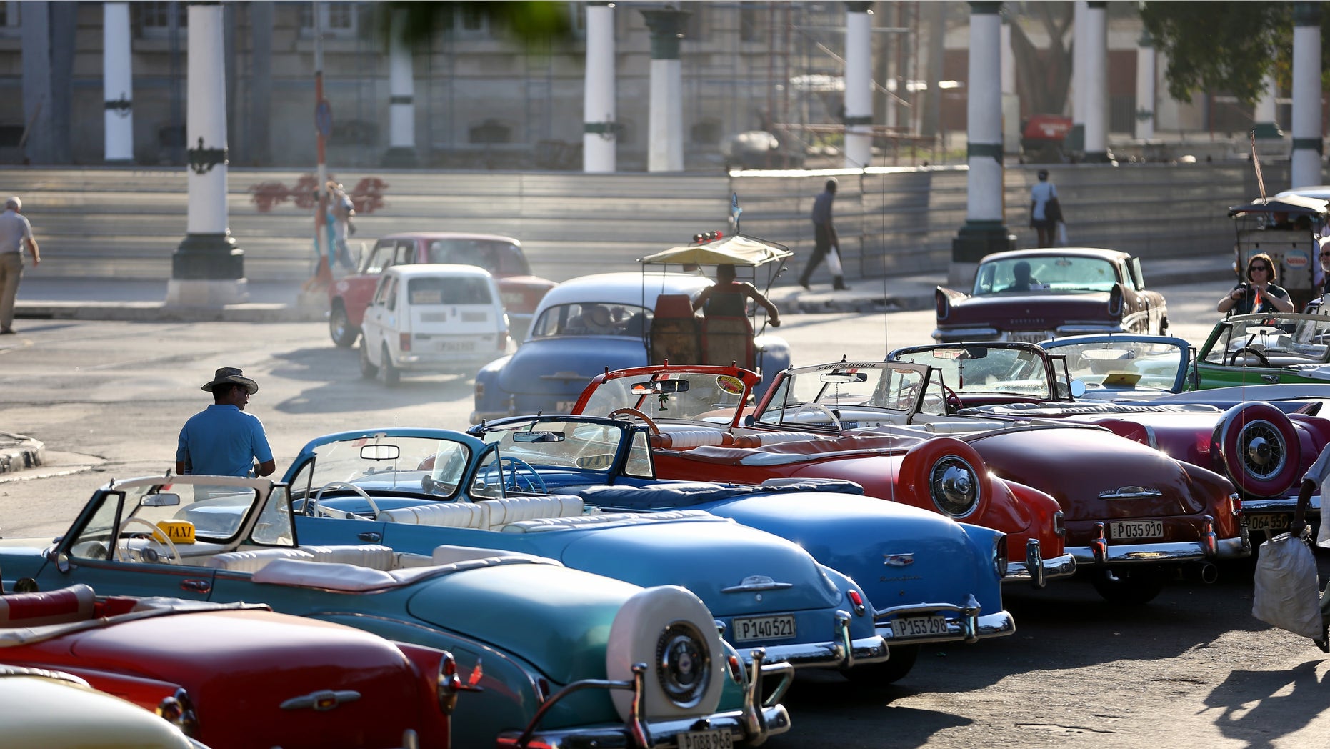 HAVANA, CUBA - FEBRUARY 28: Vintage American automobiles are seen on the street as their owners wait for tourists wanting a ride a day after the second round of diplomatic talks between the United States and Cuban officials took place in Washington, DC on February 28, 2015 in Havana, Cuba. The dialogue is an effort to restore full diplomatic relations and move toward opening trade. (Photo by Joe Raedle/Getty Images)