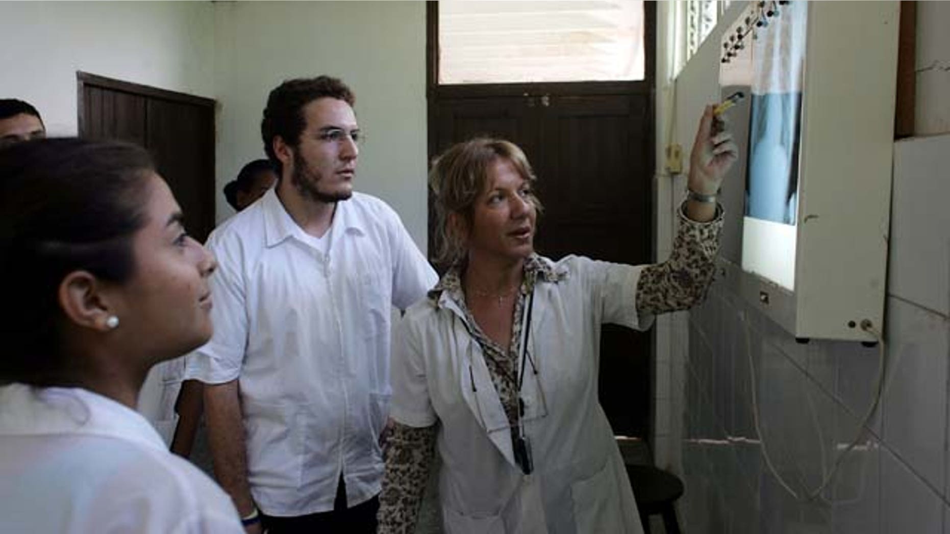 HAVANA - DECEMBER 04: Dr. Nancy Magarita Gonzalez Rodriguez goes over an x-ray with her students at the Latin American School of Medical Sciences December 4, 2006 in Havana, Cuba. Students who graduate from the Caribbean and try to practice in Brazil have overwhelmingly failed a medical exam there, according to Brazil's Ministry of Education. (Photo by Joe Raedle/Getty Images)