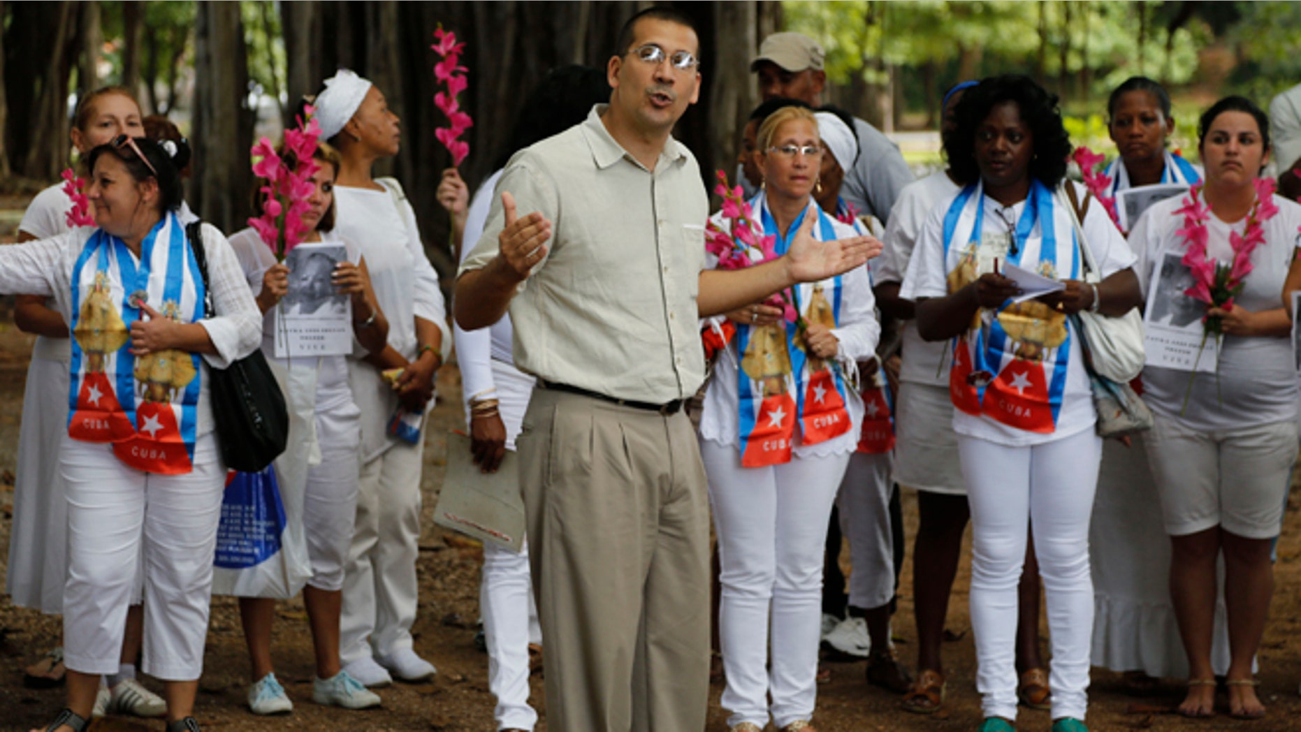 Cuban dissident Antonio Rodiles speaks during a gathering of Cuba's dissident group Ladies in White in Havana, Cuba, Sunday Dec. 28, 2014. Cubaâs government has long narrowly defined the bounds of acceptable speech, accusing many dissidents of being as agents of the U.S. government or right-wing exile groups, and subjecting them to surveillance, temporary detention and harassment. Advocates of a softer line usually receive less harsh treatment. (AP Photo/Desmond Boylan)