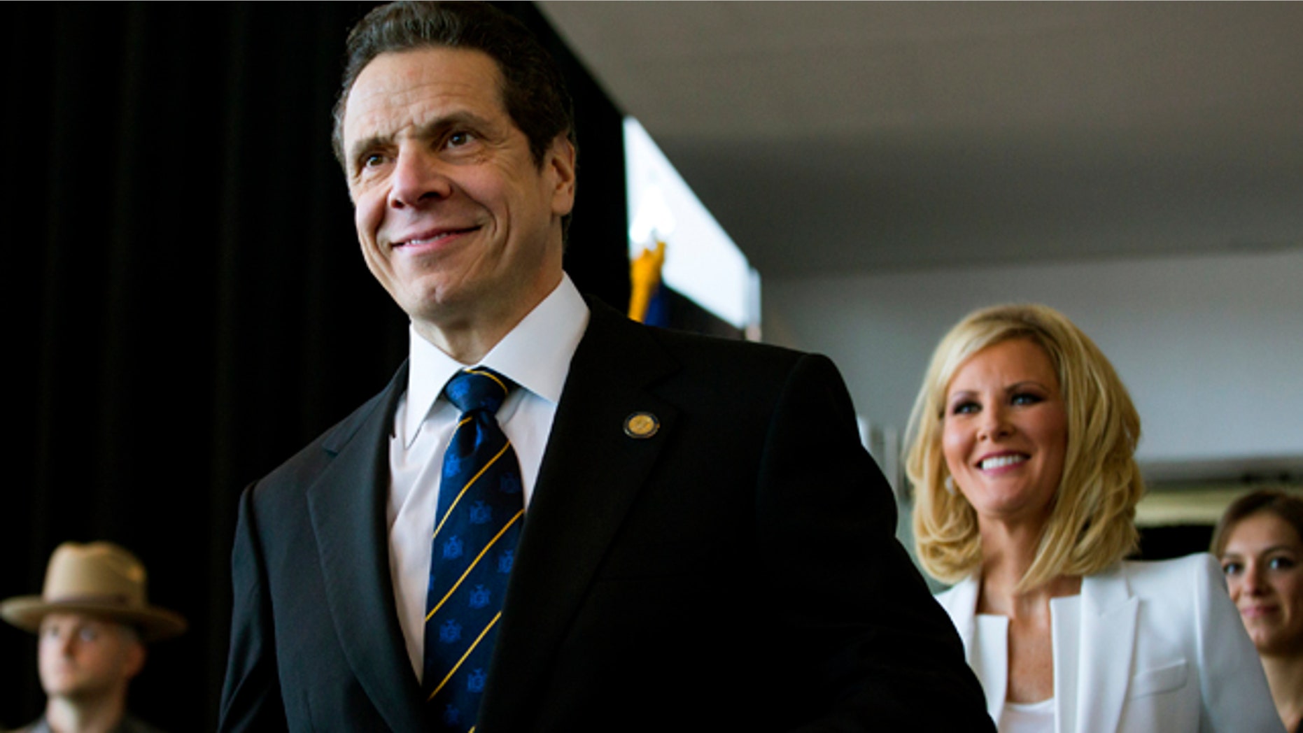 Jan. 1, 2015: New York Gov. Andrew Cuomo arrives for his inaugural ceremony at One World Trade Center in New York. At right is Cuomo's girlfriend Sandra Lee. (AP Photo/Craig Ruttle, Pool)