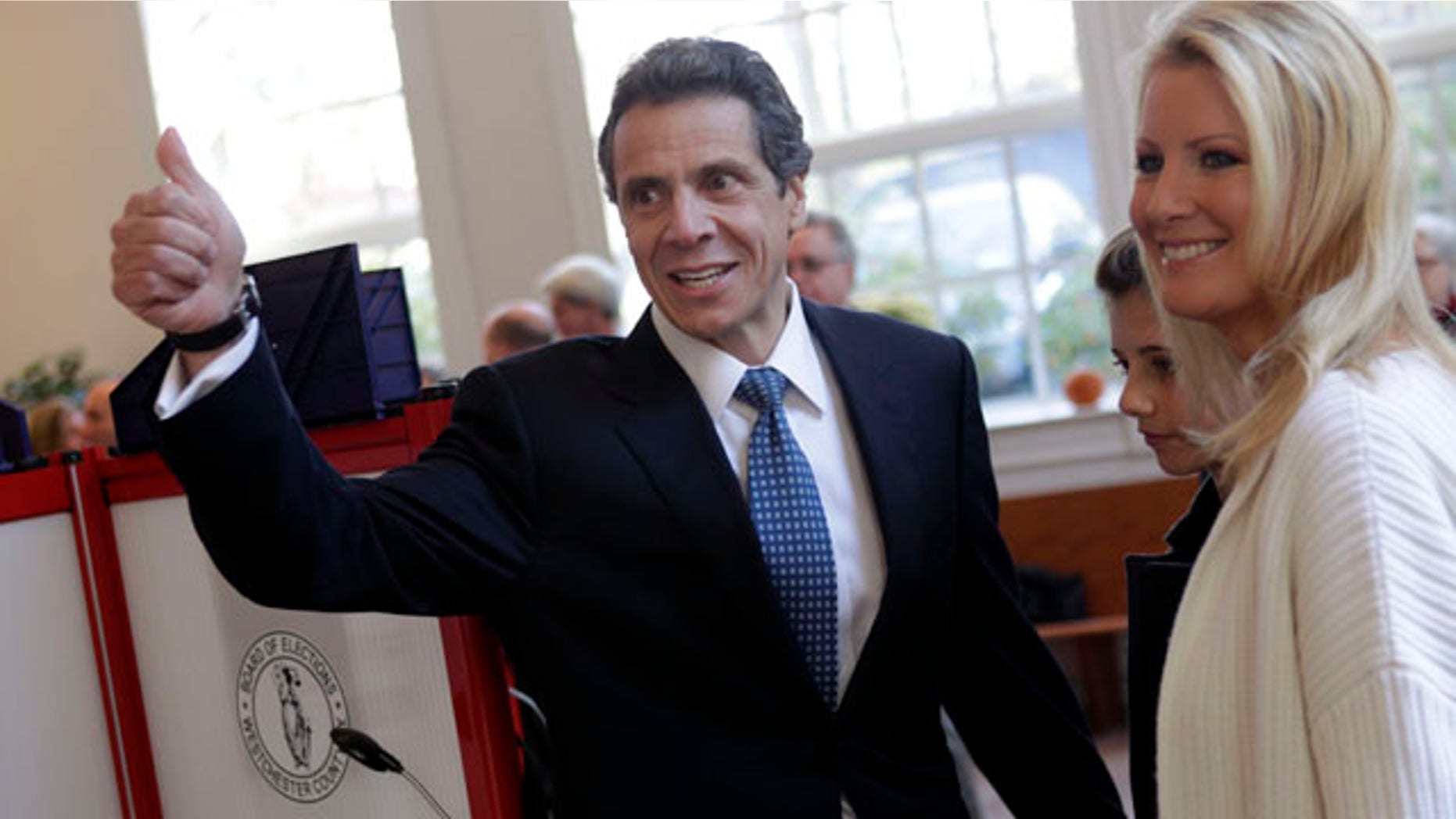 Nov. 2: Andrew Cuomo gives a thumbs-up after voting while his daughter Michaela Cuomo, center, and his girlfriend Sandra Lee look on in Mt. Kisco, N.Y.