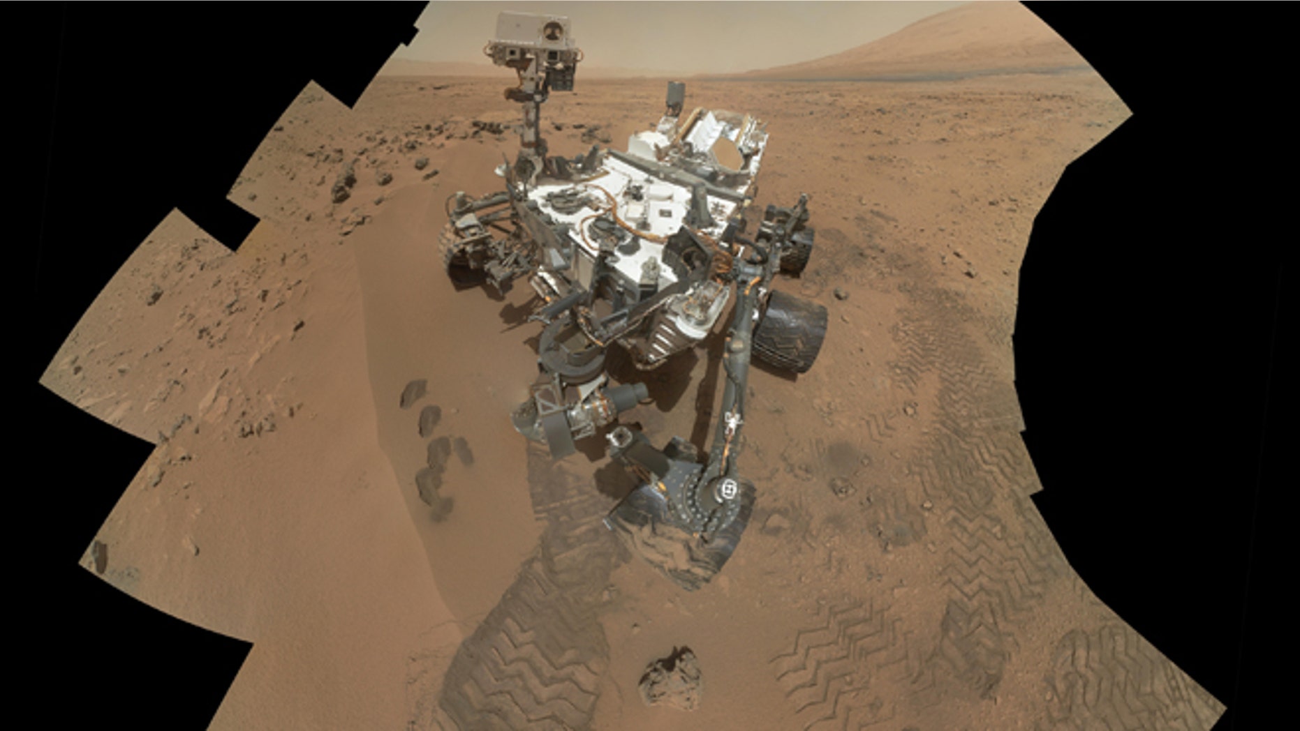 This image released by NASA shows the work site of the NASAs rover Curiosity on Mars.
