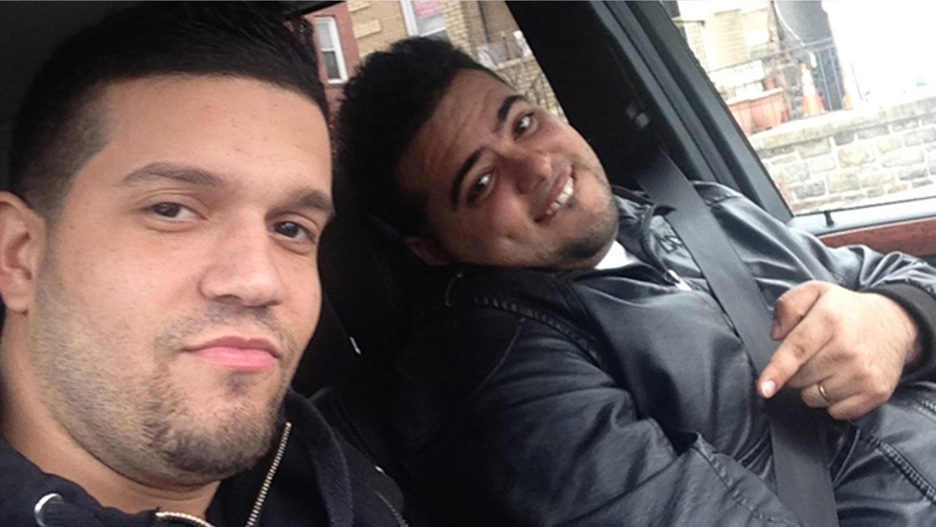 In this undated photo provided by the United States Attorneyâs Office for the Southern District of New York, Elvis Rafael Rodriguez, left, and Emir Yasser Yeje, pose with bundles of cash allegedly stolen using bogus magnetic swipe cards at cash machines throughout New York. (AP Photos/U.S. Attorneyâs Office for the Southern District of New York)