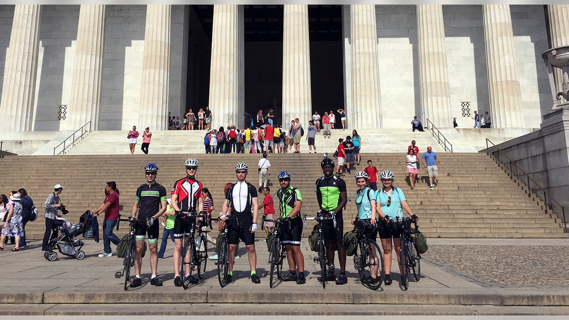 In this June 1, 2015 photo provided by Drew Bent, seven students from Harvard and MIT pose with their bicycles at the Lincoln Memorial in Washington. The seven are participating in a project called Spokes and are cycling across America, stopping in many rural towns to get students interested in science through hands-on workshops. (Courtesy of Drew Bent via AP)