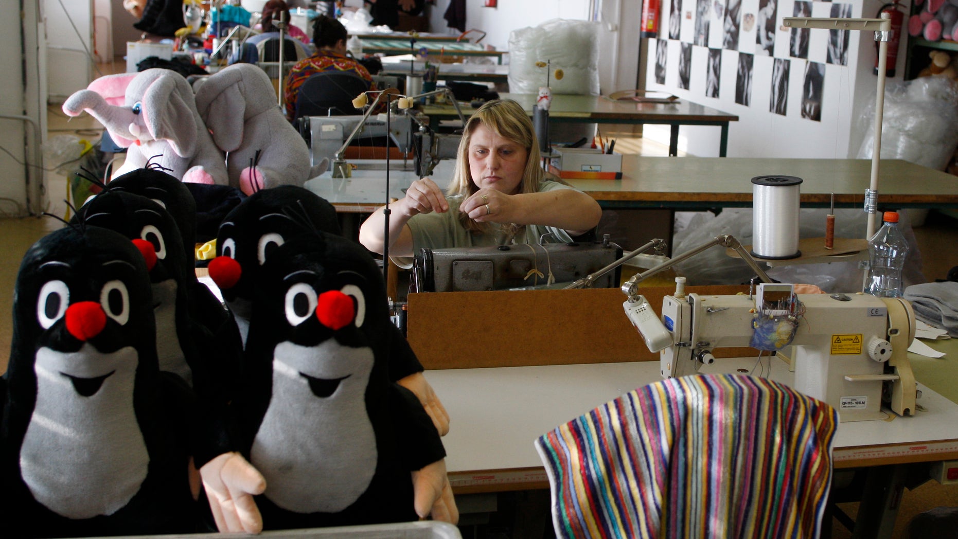 Nov. 9, 2011: A worker adjusts her sewing machine at the toy factory in Brno, Czech Republic. As Europe's economic crisis bites, toy manufacturers here are thriving. Profits are high, new markets are opening and Little Mole, a cartoon character created in 1956 and still going strong, is the unrivaled star.